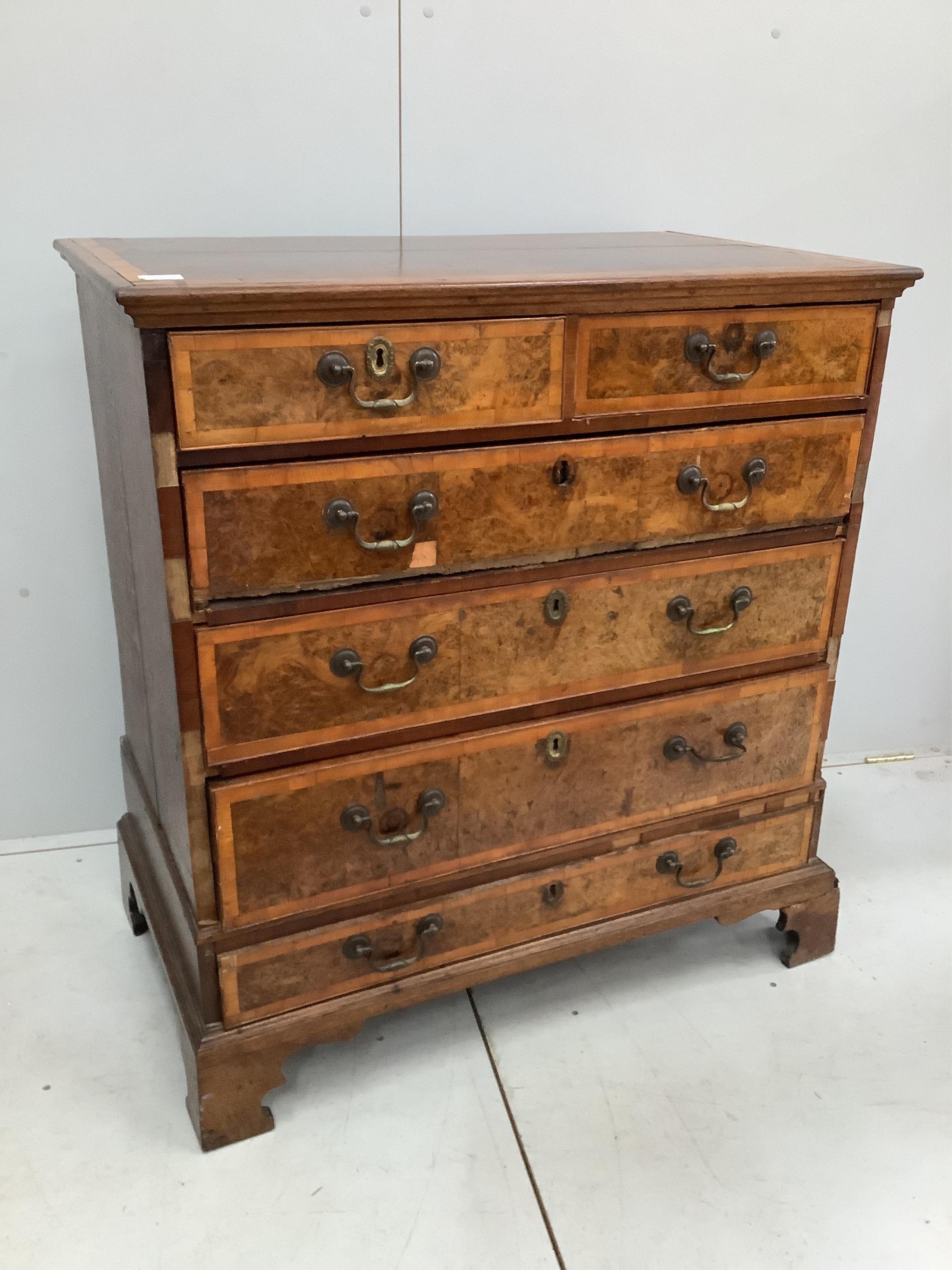 A mid 18th century and later crossbanded walnut and oak chest, width 95cm, height 103cm. Condition - poor